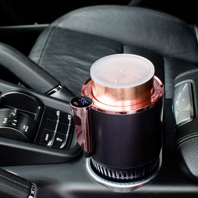 Rose gold and black car cup holder with digital display on a car dashboard.