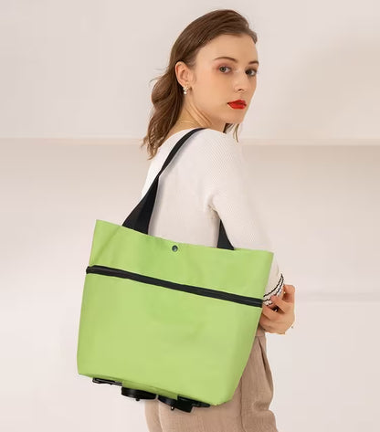 Woman holding a green tote bag against a plain background