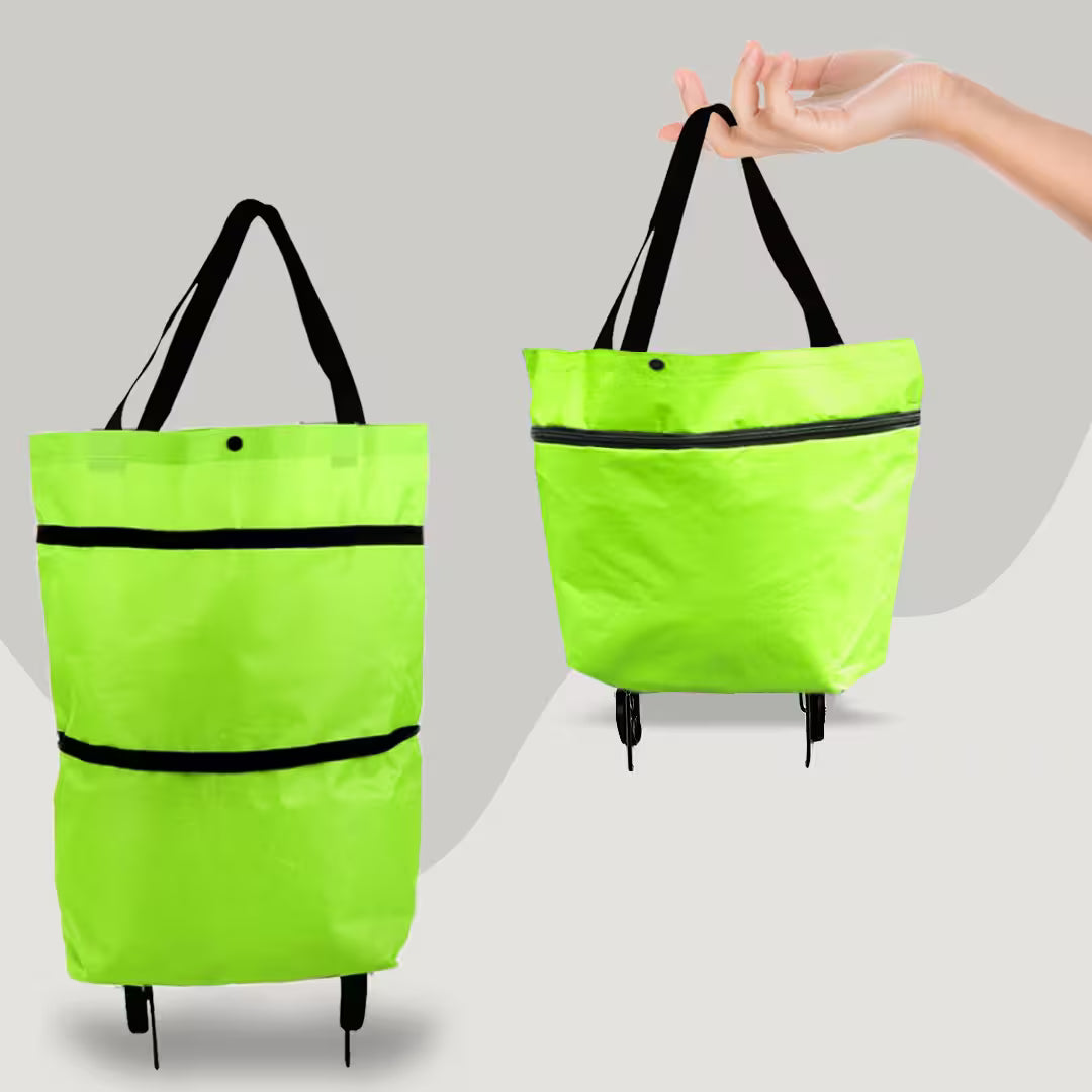 Green folding shopping bag with black straps on a gray background