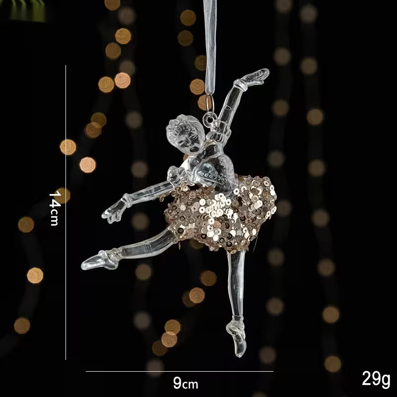 Decorative ornament of a ballerina with sequined skirt on a dark background with bokeh lights.