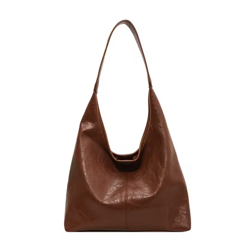 Brown leather handbag on a white background