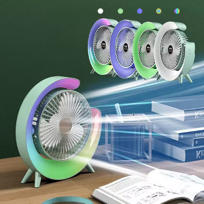 Colorful desk fan on a table with books and a cup, showing a close-up of the fan blades.