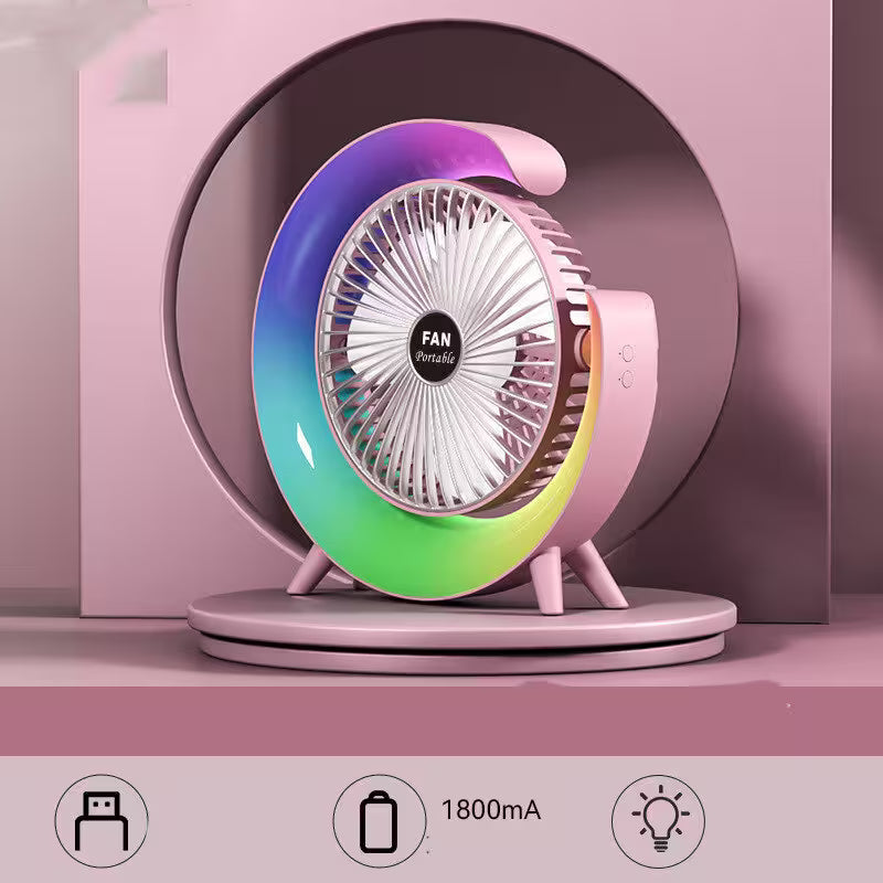 Portable fan with gradient color design on a pink background