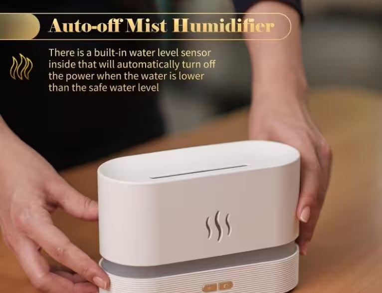 White mist humidifier with water level sensor on a wooden surface, held by hands.