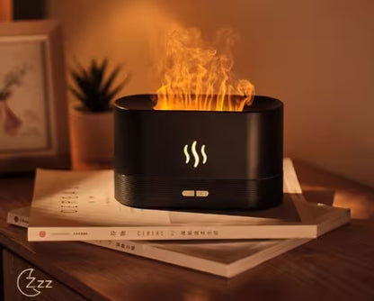 Black fire pit with flames on a stack of books, surrounded by a warm glow.