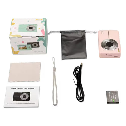 Digital camera set with packaging, cleaning cloth, USB cable, user manual, and battery on a white background