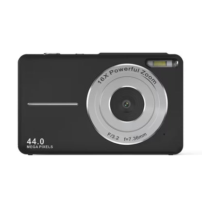 Black digital camera with silver zoom lens on a white background