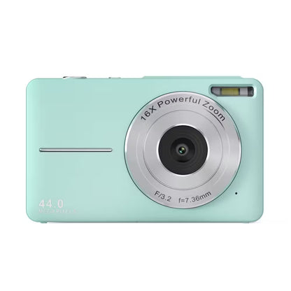 Mint green digital camera with silver zoom lens on a white background