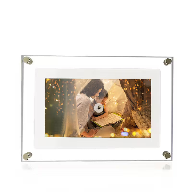 Digital photo frame displaying a romantic scene with two people reading a book, surrounded by lights.
