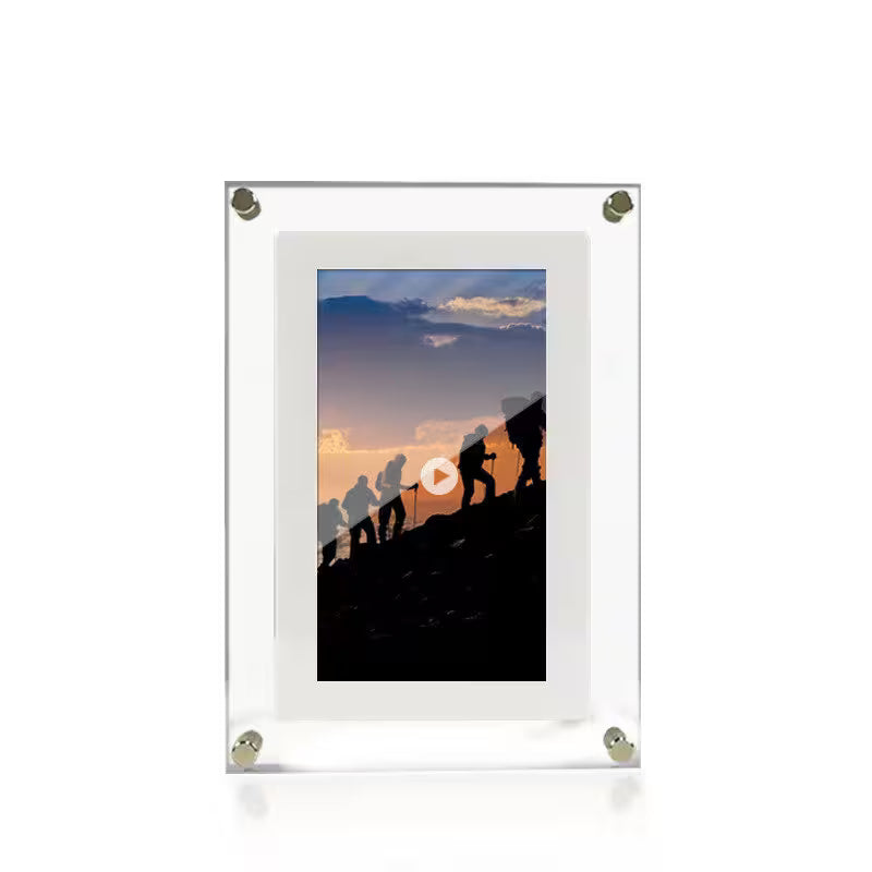 Acrylic photo frame with a scenic silhouette of people climbing a mountain at sunset.