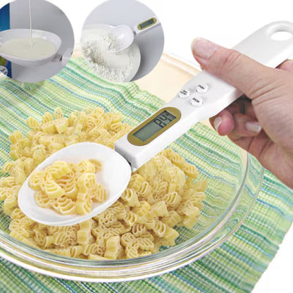 Digital measuring spoon with pasta in a bowl on a green and white checkered tablecloth