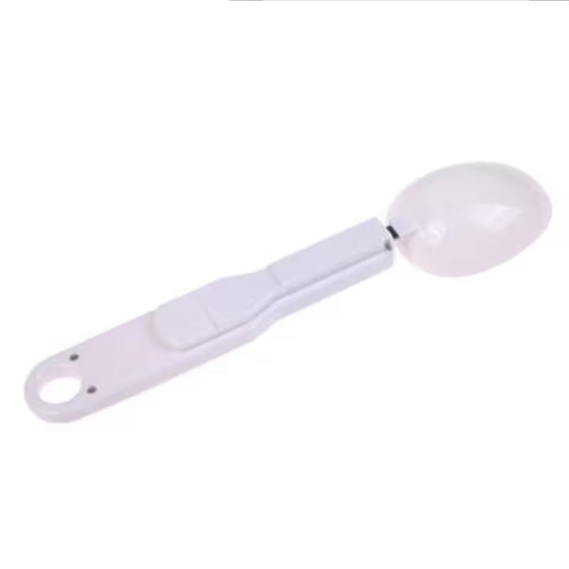 White measuring spoon on a white background