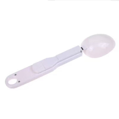 White measuring spoon on a white background