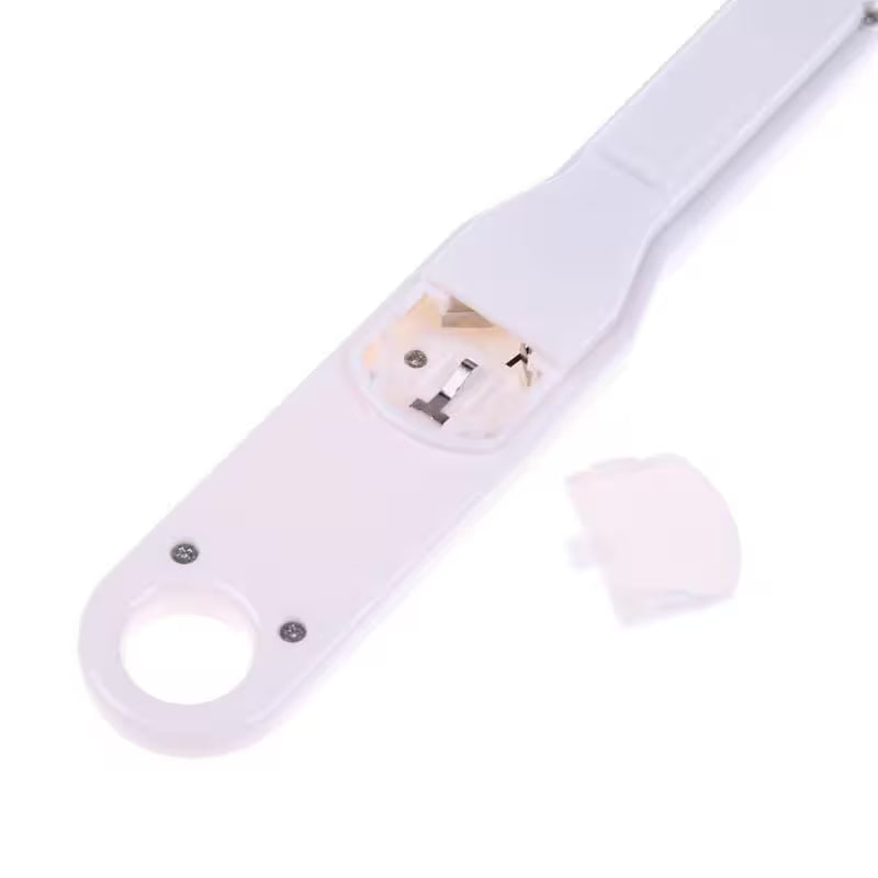 Close-up of a white electronic device with a USB connector on a white background