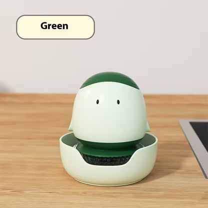 Green and white robot-like device on a wooden surface with 'Green' label above it.