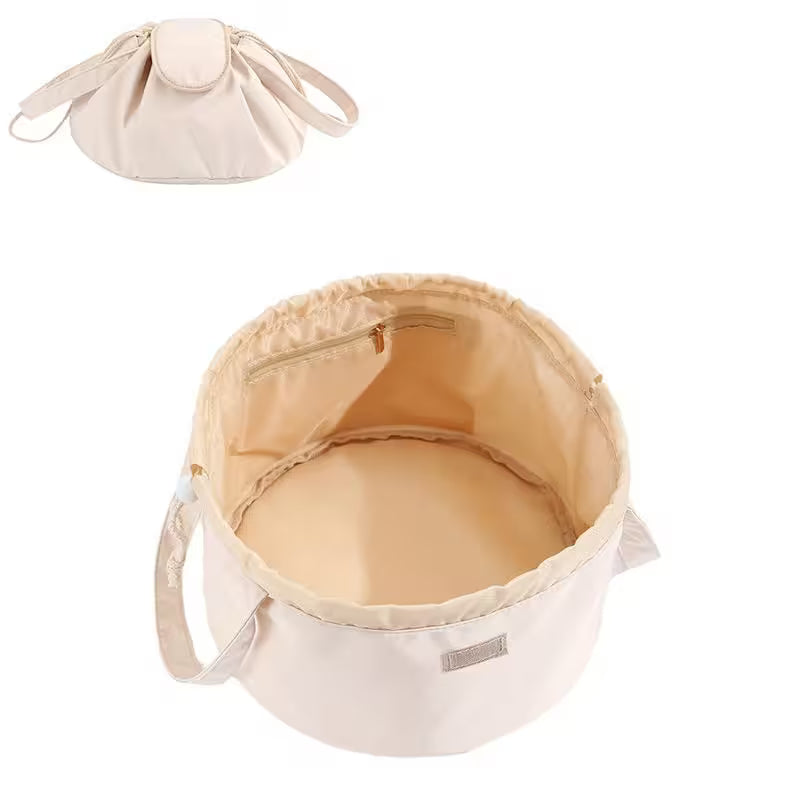 Beige fabric bag with drawstring top on a white background