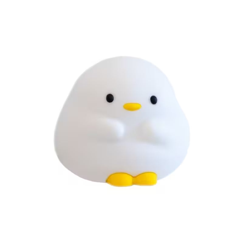 White duck-shaped night light with black eyes and a yellow beak on a white background
