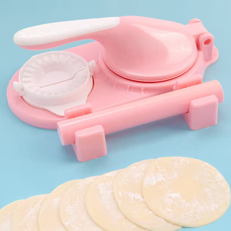 Pink dumpling maker with dumpling wrappers on a blue background