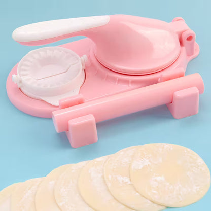 Pink dumpling maker with dumpling wrappers on a blue background
