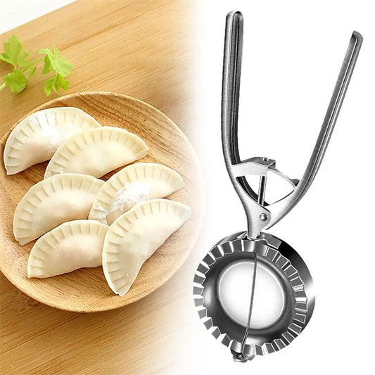 Dumpling maker on a white background with dumplings on a wooden board.