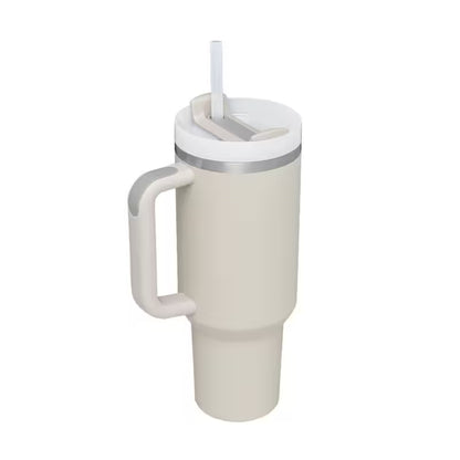 Beige mug with handle and straw lid on a white background