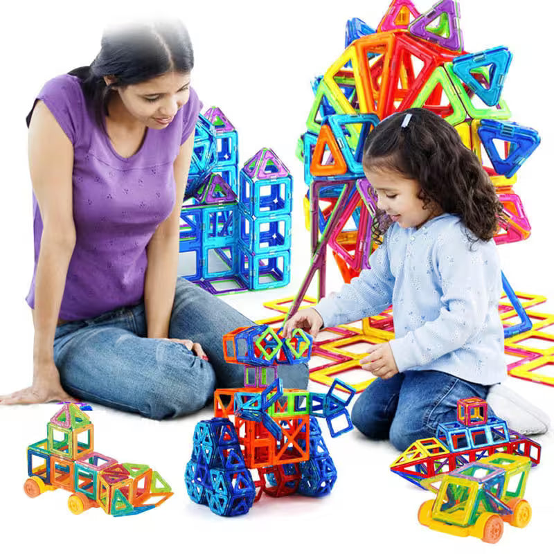 Woman and child playing with colorful magnetic building toys on a white background
