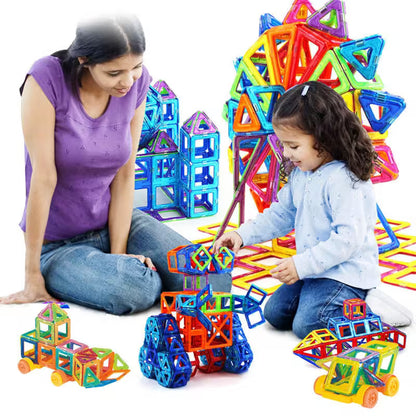 Woman and child playing with colorful magnetic building toys on a white background