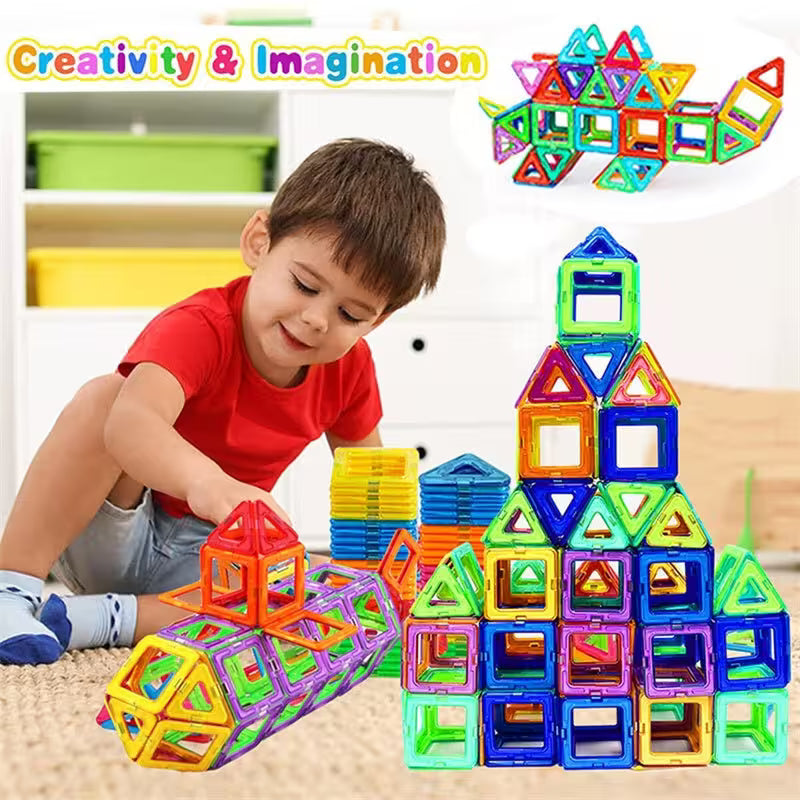 Child playing with colorful magnetic building blocks in a bright room.