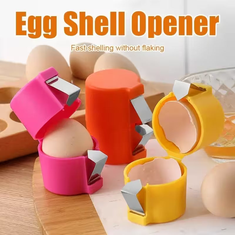 Three egg shell openers in pink, orange, and yellow on a wooden surface with eggs.
