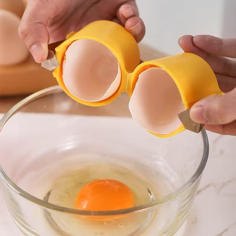 Egg separator being used to separate eggs into a glass bowl.