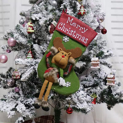 Decorative Christmas stocking with a reindeer design hanging from a Christmas tree.