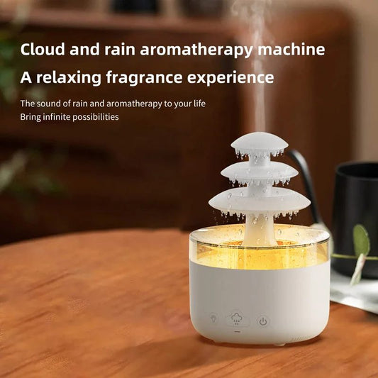 Cloud and rain aromatherapy machine on a wooden surface with text describing its features.