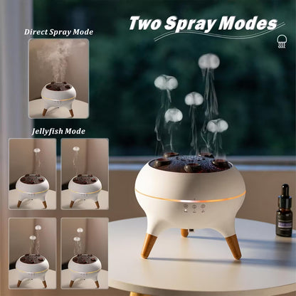 Humidifier with two spray modes on a table with a bottle of essential oil.