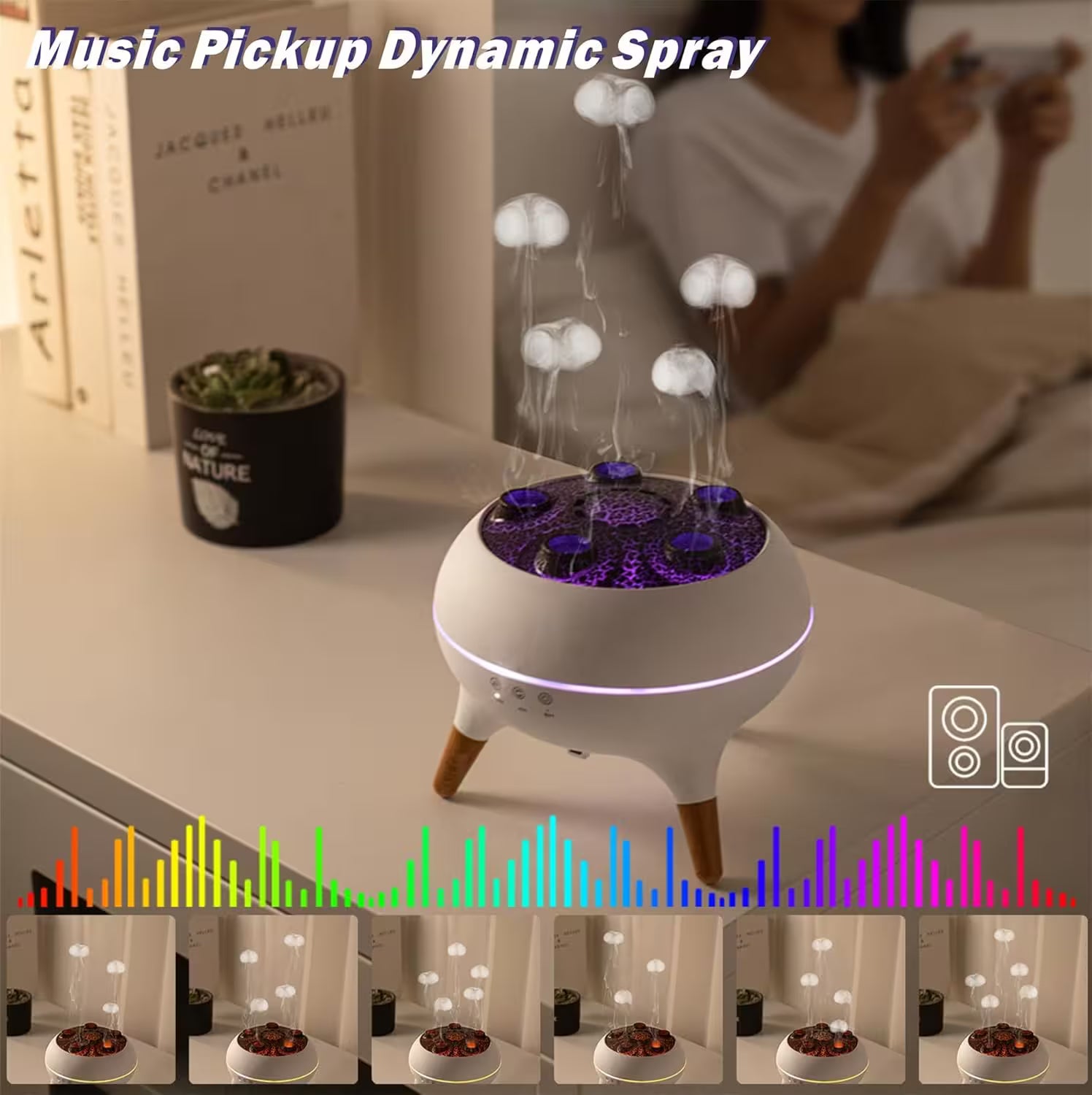 Music pickup dynamic spray device on a table with a blurred person using a phone in the background.