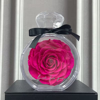 Decorative bottle with a pink rose and 'just for you' text on a neutral background
