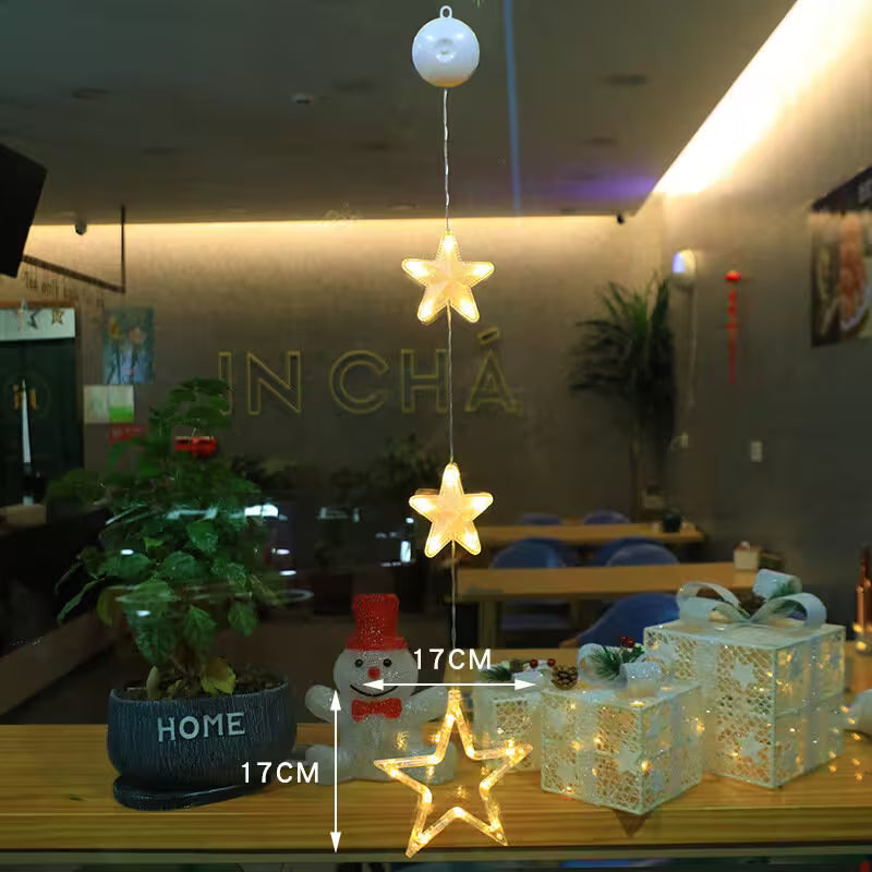 Decorative string lights shaped like stars on a table with measurements, set against a restaurant interior.