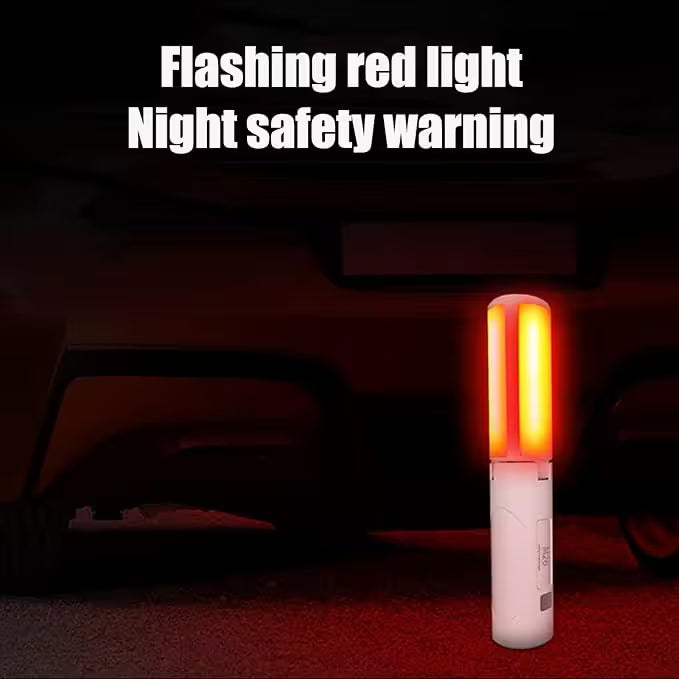 Flashing red light night safety warning device on a car's undercarriage.