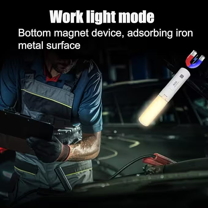 Person using a work light with a magnetic base in a dark setting