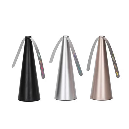 Three metallic nozzles on a white background