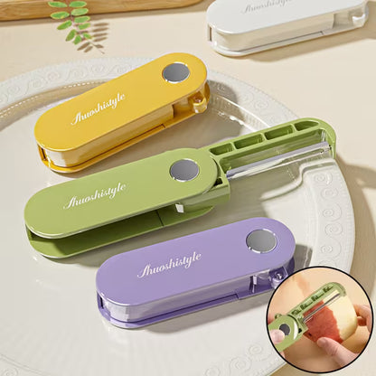 Three colorful vegetable peelers on a white plate with an inset showing one being used.