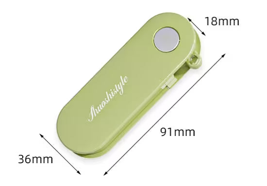 Green hair clip with dimensions labeled on a white background