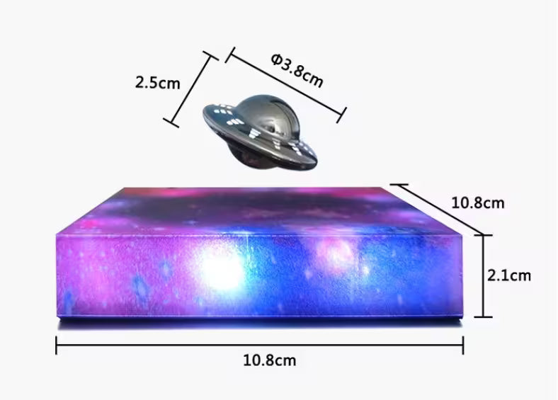 Measurement chart of a small UFO model and a rectangular block with galaxy design on a white background.