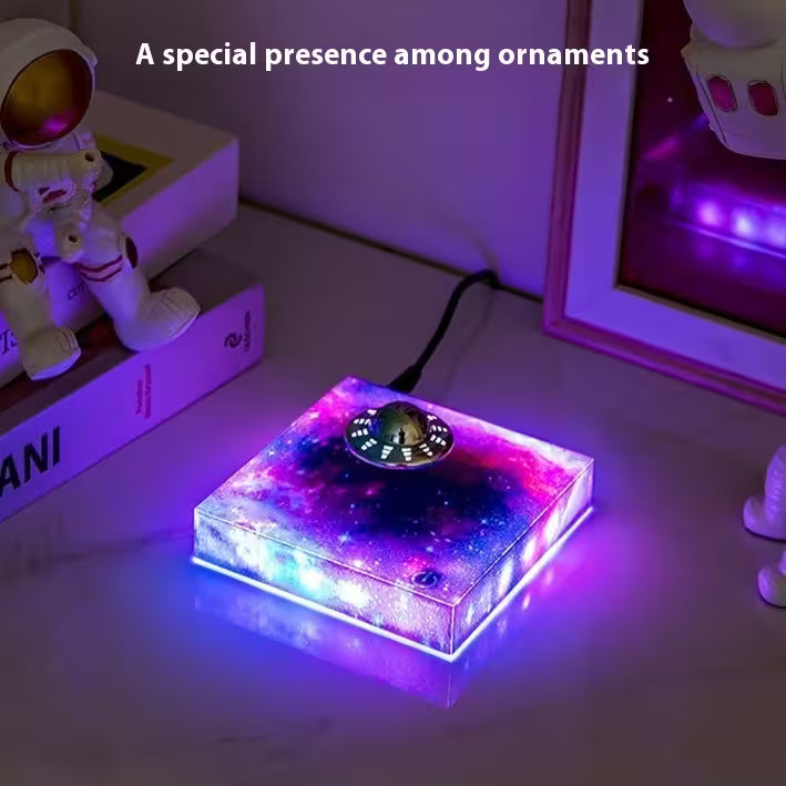 Glowing LED light box on a surface with text 'A special presence among ornaments'.