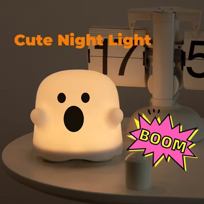 Cute night light shaped like a ghost with a 'BOOM' graphic and text 'Cute Night Light' on a dark background.