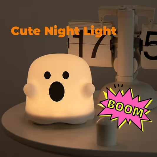 Cute night light shaped like a ghost with a 'BOOM' graphic and text 'Cute Night Light' on a dark background.