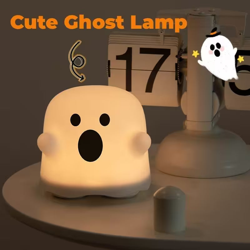 Cute ghost-shaped lamp with a calendar in the background