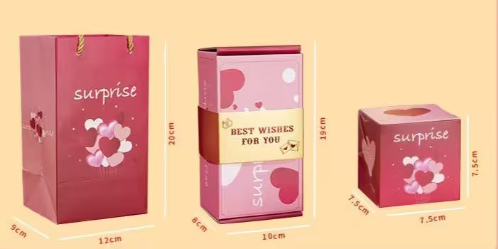 Set of three pink gift boxes with 'surprise' and 'best wishes for you' text, accompanied by measurements on a beige background.