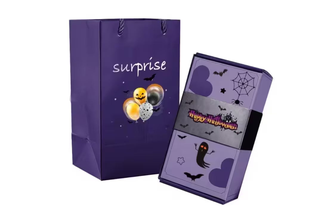 Purple Halloween-themed gift bag with 'surprise' text and a matching box on a white background.