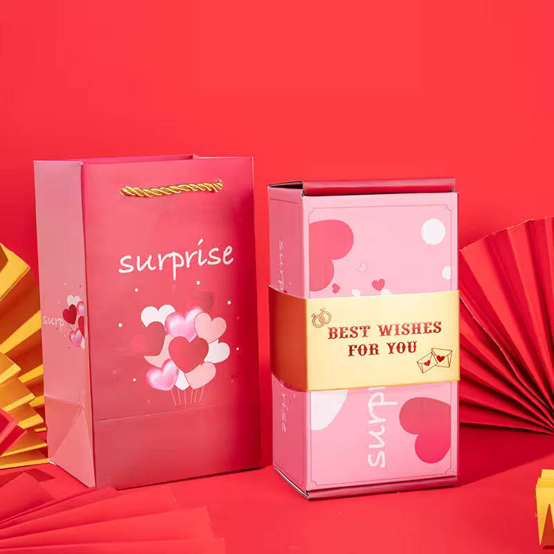 Pink gift bag and box with 'surprise' and 'Best Wishes For You' text on a red background