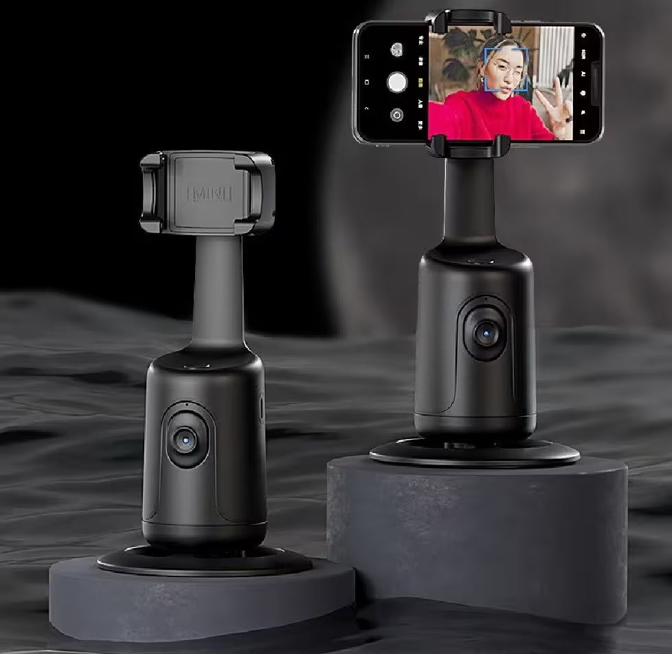 Black smartphone gimbal with smartphone displaying a person in a red shirt on a dark background